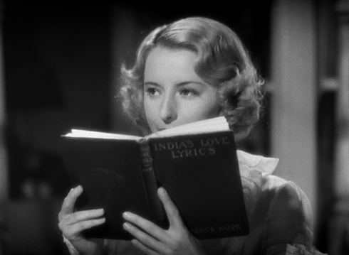 Stella ropes in her man by wooing him with her beauty and her bookworm sensibilities. (Screen capture by Lindsey for TMP)