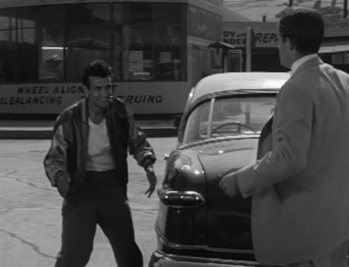 A faux-fight with one of his cronies allows Hal to have a "meet cute" with the girl he plans on kidnapping. (Screen capture by Lindsey for TMP)