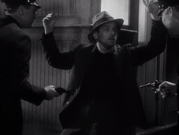 "Don't shoot, officers! I'm just here for the hamburgers!" (Screen capture by Lindsey for TMP)