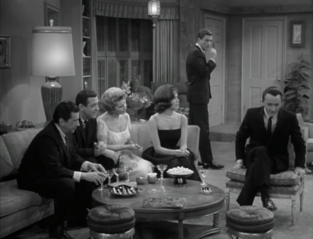 Everyone else at the party is captivated by Jim's story. (Screen capture by Lindsey for TMP)