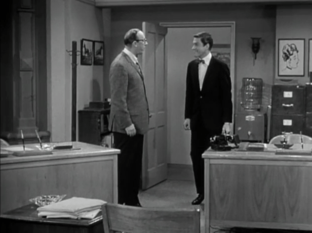 Rob enters the office on his first day as head writer. (Screen capture by Lindsey for TMP)