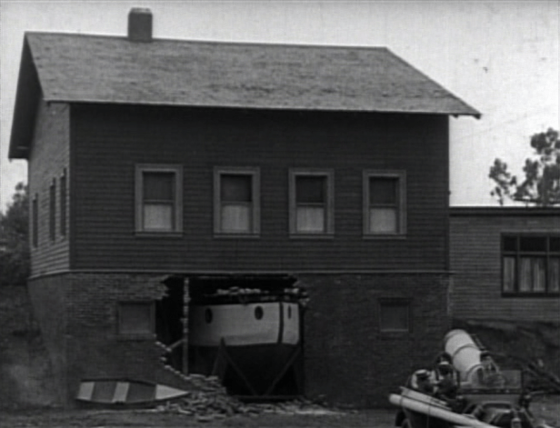 Buster has trouble getting his boat out of its home. (Screen capture by Lindsey for TMP)