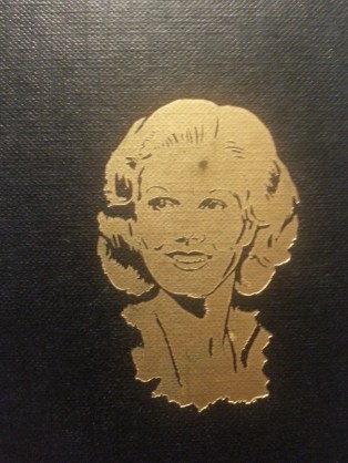 This golden illustration of Jean appears on the bottom right of the book's front cover. (Photo by Lindsey for TMP)