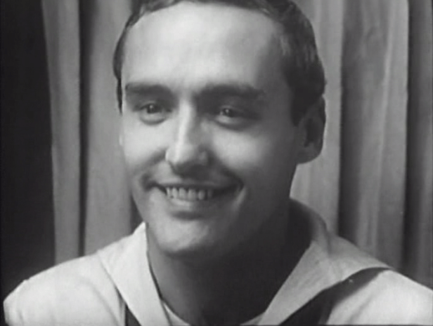 Johnny's first stop on his night on the town is a photo booth. (Screen capture by Lindsey for TMP)