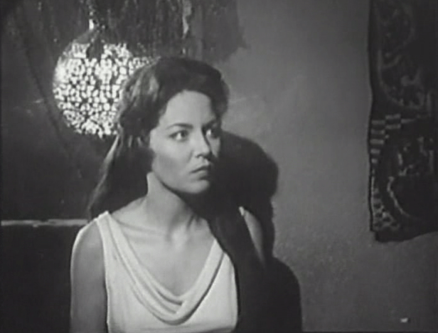 Mora's a little creepy and standoffish, but Johnny continues to pursue her. (Screen capture by Lindsey for TMP)