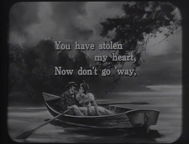 Lyrics for each song give the audience a chance to sing a bit of karaoke before the feature in "Let's Sing a Song About the Moonlight." (Screen capture by Lindsey for TMP)