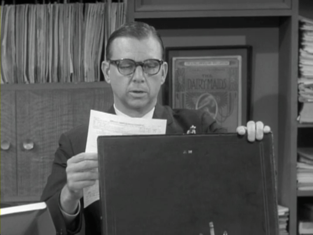 Buddy is sure that the visitor from the IRS is an actor, hired by Rob. (Screen capture by Lindsey for TMP)