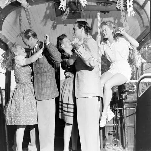 Ain't no party like a '42 party, cause a '42 party... is held in a streetcar! (Image via vintag.es)