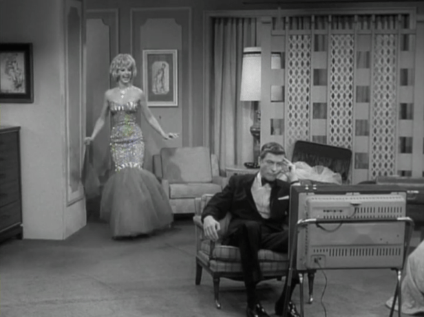 Rob has to watch the fashion show in a neighbor's room when his TV breaks. (Screen capture by Lindsey for TMP)