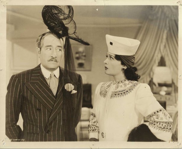Even Adolphe Menjou gets in on the hat action in this kooky film! (Image via Opera Rex)