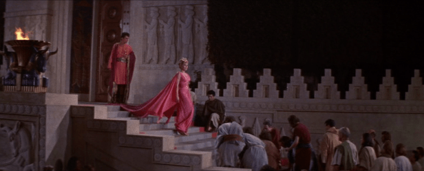 Samarra's kneeling admirers greet her at the temple. (Screen capture by Lindsey for TMP)