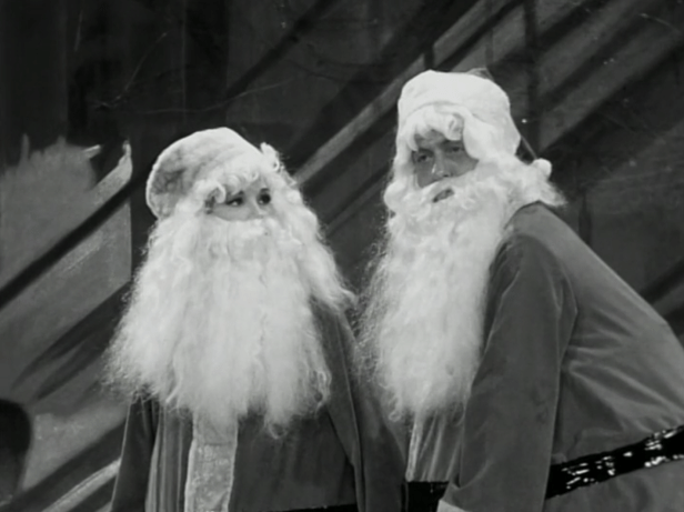 Santa Laura and Santa Rob take the stage (Screen capture by Lindsey for TMP)