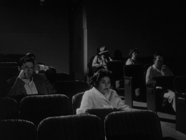 While Homer is out with his friends, Yvonne spends the evening at the movies. (Screen capture by Lindsey for TMP)